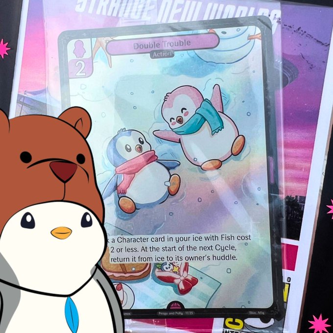 A "Double Trouble" Action card (cost 2) featuring two cute penguins in scarves is displayed in front of a "Starlight New Worlds" backdrop, fitting the user's post about their haul from the Pudgy Penguins booth at Comic Con. A cartoon brown bear and white penguin avatar decorates the corner of the image.