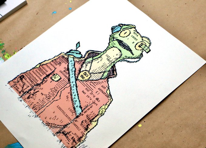 A mixed-media artwork on paper depicts a green-headed, wide-mouthed creature wearing a torn, pink shirt-like garment made from collaged newspaper and printed text.