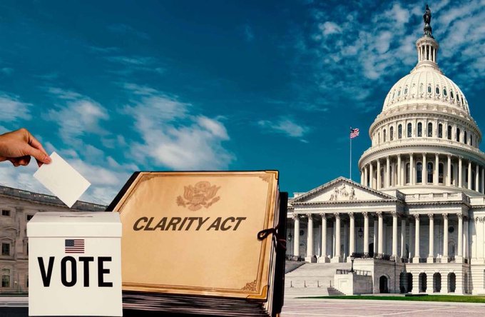 A 'CLARITY ACT' document displayed prominently with the US Capitol building in the background, alongside a ballot box labeled 'VOTE' with a hand inserting a vote.