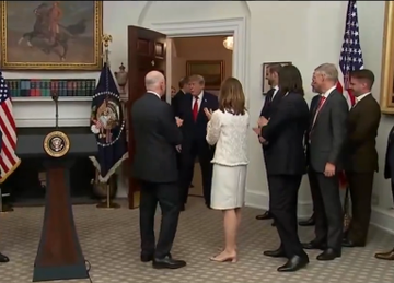 Gathered in the Oval Office, President Donald Trump welcomes a delegation—including an individual in a white skirt suit—for a White House meeting during a productive week of discussions in Washington, D.C.
