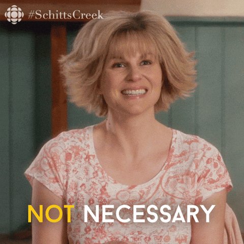 The image features a woman with short blonde hair wearing a pink floral shirt, sitting against a green wall. She has a big smile on her face as she looks directly at the camera. The caption of the image reads "not necessary", which is written in yellow text above and below the woman's head.
