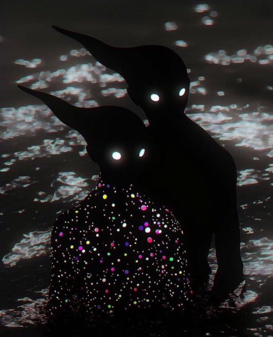 Two silhouetted creatures with glowing eyes perch near a body of water, one of them covered in glowing colorful spots.
