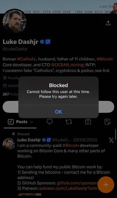 A Twitter profile for 'Luke Dashjr @LukeDashjr' showing a 'Blocked' popup message stating 'Cannot follow this user at this time.'