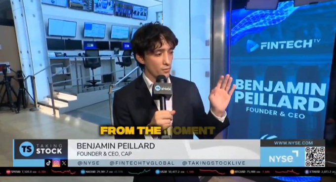 Benjamin Peillard, Founder & CEO of CAP, speaks during a Fintech TV interview on the NYSE floor. The broadcast displays social handles @NYSE, @FINTECHTVGLOBAL, and @TAKINGSTOCKLIVE, along with a ticker showing SPY at 583.00 (+0.08) and ETHUSD at 2,803.5, contextualizing the discussion around CAP's tokenomics and $12M community buyback announcement.