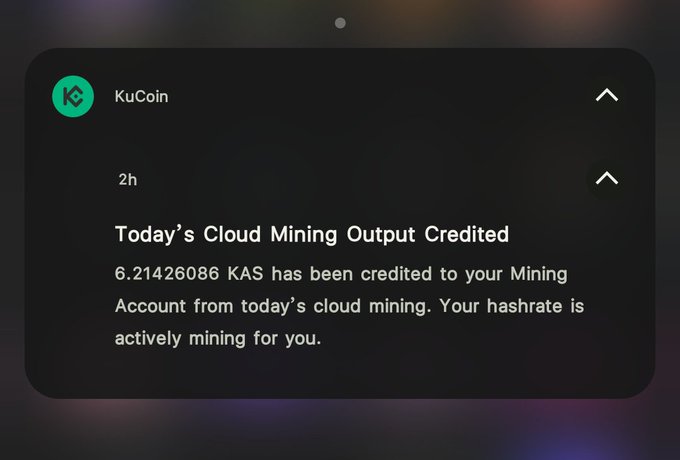 A KuCoin notification showing 'Today's Cloud Mining Output Credited' announcing that 6.21426086 KAS has been credited to a Mining Account.