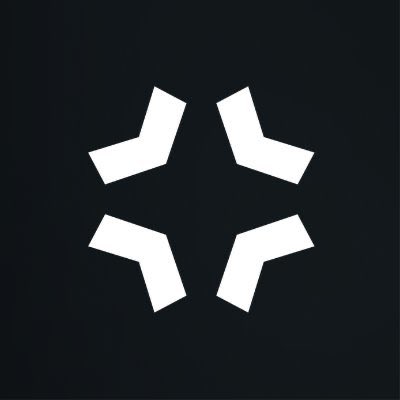 A minimalist logo featuring four white chevron shapes arranged in a cross or starburst pattern on a black background, which is the symbol for the Binance cryptocurrency exchange.