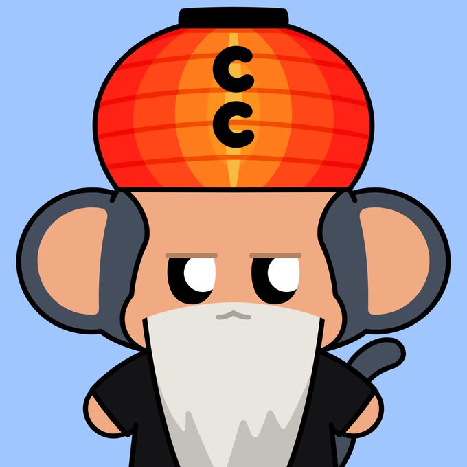 A cartoon monkey character with a long white beard wears a large red and orange helmet marked 'CC' on a blue background.