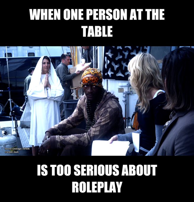 A behind-the-scenes meme image with text 'WHEN ONE PERSON AT THE TABLE IS TOO SERIOUS ABOUT ROLEPLAY' showing actors including one in white robes and another in a leopard-print headwrap in costume.