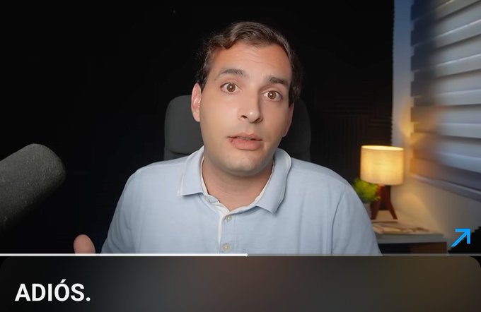 A man in a light blue polo shirt speaks directly to the camera with the word 'ADIOS.' displayed at the bottom of the frame.