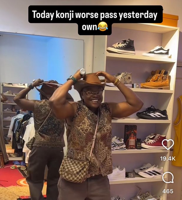 The image features a man wearing a cowboy hat standing in front of a shoe rack filled with various types of shoes. The man appears to be posing for a photo, possibly for a social media post or a video. The caption of the image includes some text that reads "Today Koniji Worse Pass Yesterday Own", which seems to be a reference to a popular meme or joke about the previous day's events.