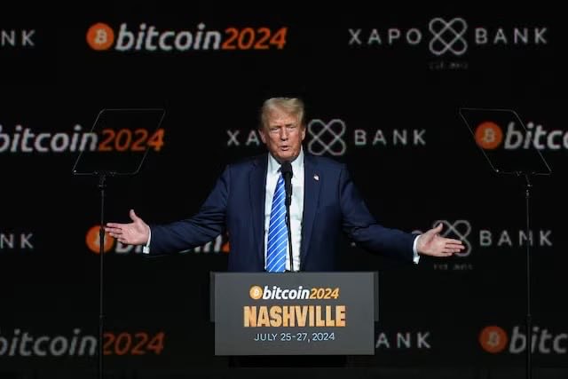 Pictured here, Donald Trump speaks at a Bitcoin 2024 event in Nashville, an image that relates to the post's claims of his involvement in potentially questionable cryptocurrency profits. The backdrop features branding for "bitcoin2024" and "Xapo Bank."