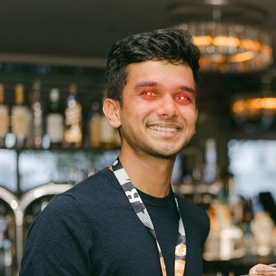 A photo of Chaitanya Jain, Strategy's corporate treasurer, smiling in what appears to be an office or bar setting. He is the official quoted in the post about Strategy's Bitcoin treasury potentially funding shareholder dividends for the next 31 years.