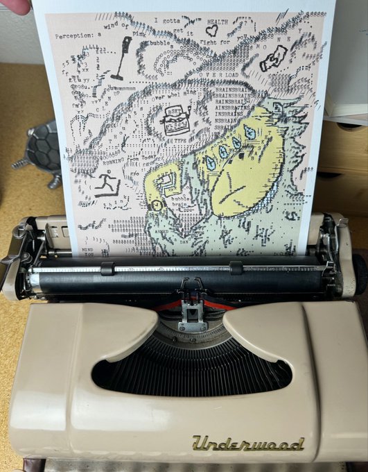 A vintage Underwood typewriter with a paper featuring an abstract black ink drawing, colored pencil shading, and handwritten text including 'HEALTH' and 'wind of perception'.