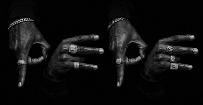 A black-and-white image displays four tattooed hands showcasing an array of iced-out rings and chain bracelets, prominently featuring letters spelling out "HPEPE" and "PEPE." This flashy display of hip-hop style jewelry aligns with the post's reference to $PEPE and $HPEPE, mimicking a rapper's promotional flex for the meme coins.