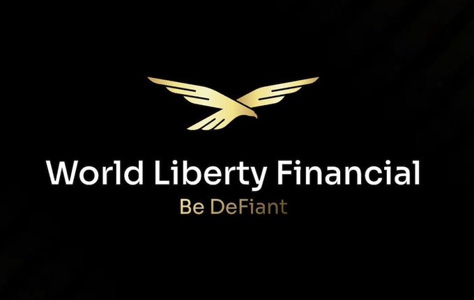 The image displays the World Liberty Financial logo, featuring a golden eagle emblem with outstretched wings above the company name in white text and the tagline "Be DeFiant" in gold, all set against a black background. This branding corresponds to the announcement about World Liberty Financial receiving conditional OCC approval for a national trust bank charter, marking a notable shift from typical stablecoin news toward traditional banking legitimacy.