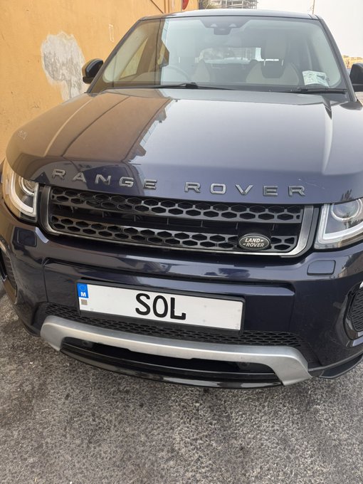 The image shows the front of a dark blue Range Rover SUV with a custom license plate reading "SOL," creating a playful connection to the Solana ($SOL) cryptocurrency token often discussed on social media. The post's "$SOL" tag cleverly plays on the car plate's text to engage with the crypto community.