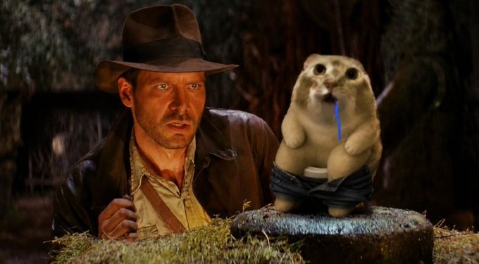 A digitally edited image shows Indiana Jones looking shocked next to a prairie dog wearing jeans and holding a blue popsicle on a rock.