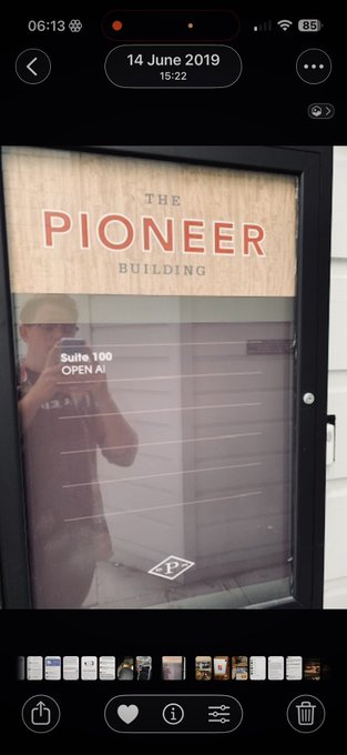 A smartphone photo shows “THE PIONEER BUILDING” door and a directory for “Suite 100 OPEN AI”; the screenshot is dated 14 June 2019 at 15:22.
