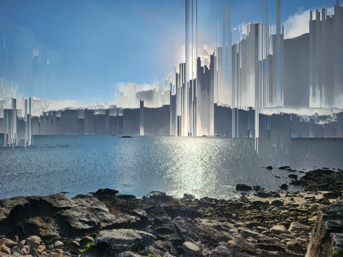 A surreal digital landscape featuring a rocky shoreline in the foreground, with shimmering water and towering, translucent crystalline structures rising into a bright blue sky.