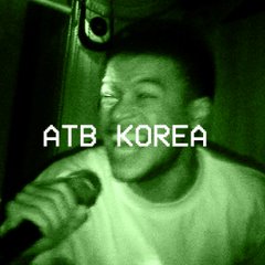 A young man smiles while holding a microphone, with the text "ATB KOREA" displayed in a retro-style white font across the green-tinted image. The caption references CZ (Binance) and promotes a related post, suggesting the image is connected to a crypto or Web3 event highlight.