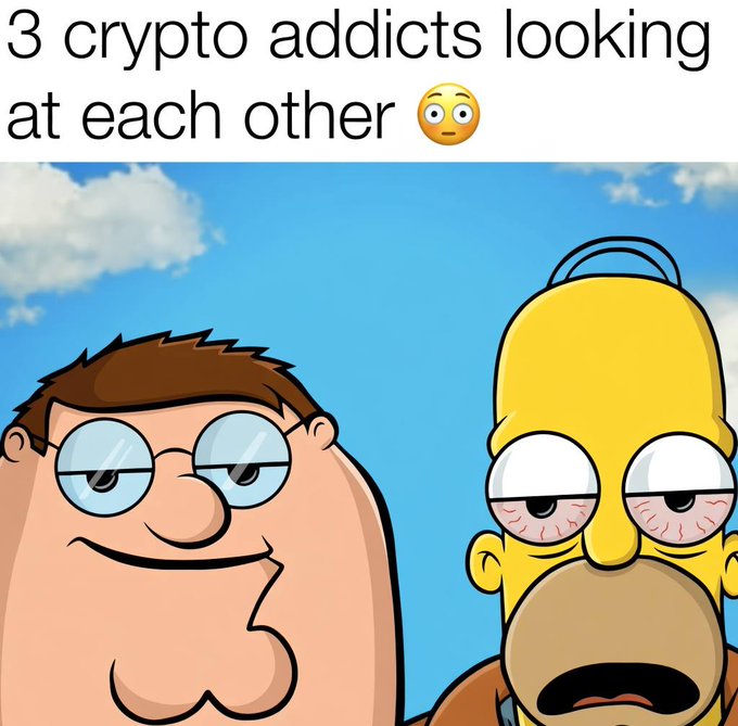 A meme image with the caption '3 crypto addicts looking at each other' featuring cartoon characters Peter Griffin from Family Guy and Homer Simpson with bloodshot eyes staring at each other.