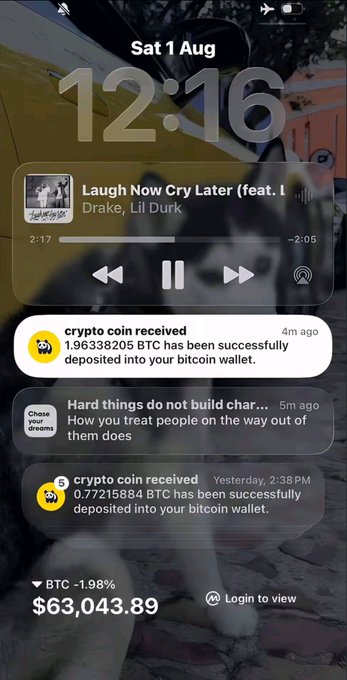 A screenshot of an iPhone lock screen displaying the time 12:16 on Sat 1 Aug, featuring a music widget playing "Laugh Now Cry Later" by Drake and Lil Durk, and three crypto-related notifications showing bitcoin deposits totaling 2.636 BTC and a current BTC price of $63,043.89 (-1.98%). The notifications and BTC price tag correspond with the poster's celebration of gaining over $138k on August 1st.