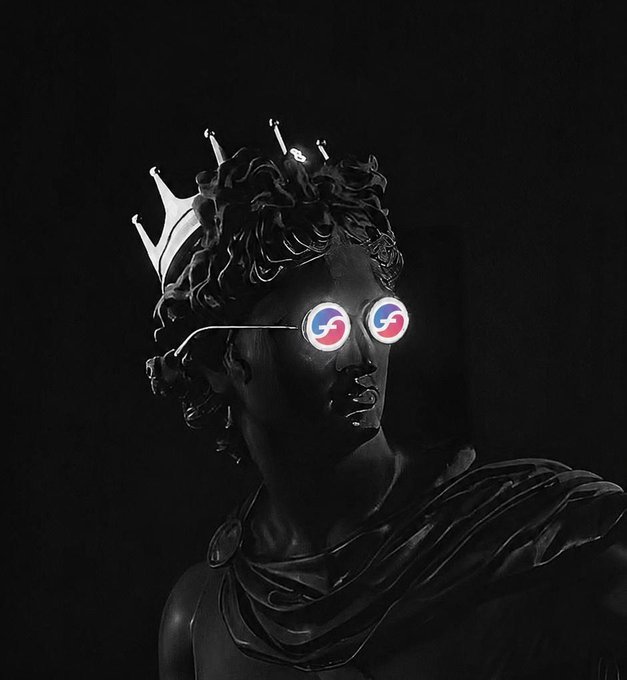 A black sculptural figure wearing a crown and sunglasses with red and blue circular logos for the lenses, set against a black background.