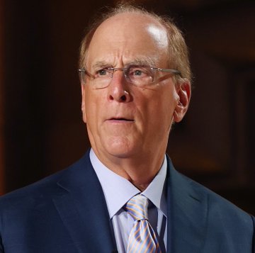 A portrait of Larry Fink, the CEO of BlackRock, wearing glasses and a dark suit with a striped tie. The image relates to the post as it shows the head of the firm whose clients just purchased $173.3 million worth of $ETH.