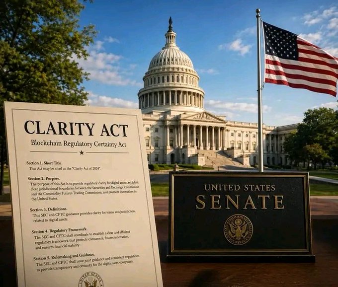 The image features a sign that reads "Clarity Act" next to an American flag, with the words "United States Senate" written below it. The text also mentions that the Senate has just announced to restart negotiations for the crypto market structure. This suggests that there might be discussions or decisions related to cryptocurrency regulations and policies taking place in the Senate.