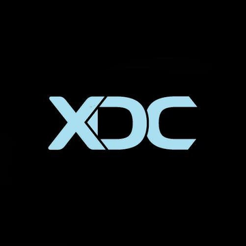 A stylized light blue "XDC" logo (likely representing the XinFin blockchain) is displayed on a solid black background, visually anchoring the post's enthusiastic promotion of the $XDC token heading toward Jupiter and a potential bull run.