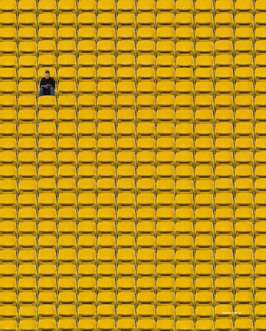 A lone figure sits among a vast sea of empty yellow stadium seats, symbolizing the anticipation and quiet before the Bitcoin crowd gathers for Monday's event. The watermark "financepolo.pl" appears in the bottom right corner, linking the image to the "$BTC" teaser about upcoming market activity.