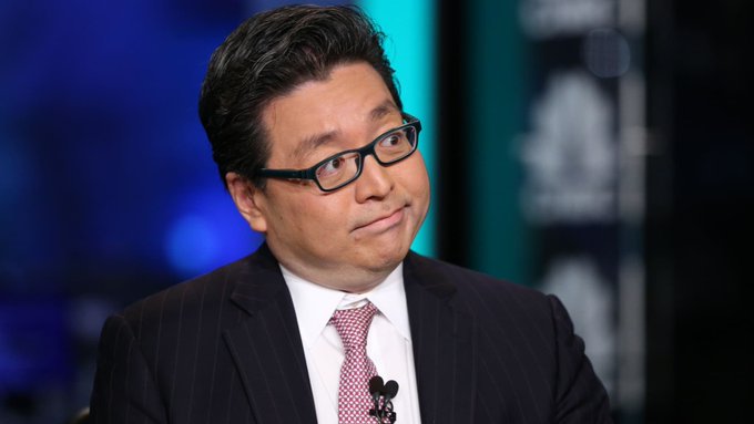 The image features a man wearing glasses and a suit, who appears to be a news anchor or reporter. He has his head tilted back with an expression of concern or thoughtfulness. The background shows a blue wall with white text that reads "Tom Lee made a point about Ethereum". This suggests the man might be discussing the current state of the Ethereum blockchain or its impact on the cryptocurrency market, as Tom Lee is known for making statements and opinions about various topics.