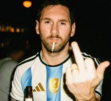 A photo of soccer star Lionel Messi wearing an Argentina national team jersey, holding a cigarette in his mouth and gesturing with his middle finger.