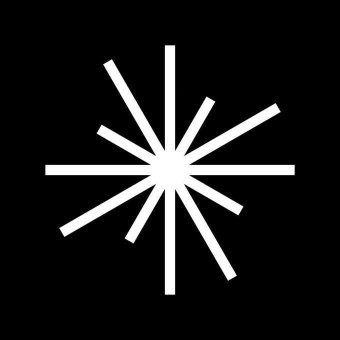 A white star-shaped symbol composed of radiating lines on a black background.