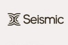 A simple white background displaying the black 'Seismic' logo with its distinctive wave-like emblem.