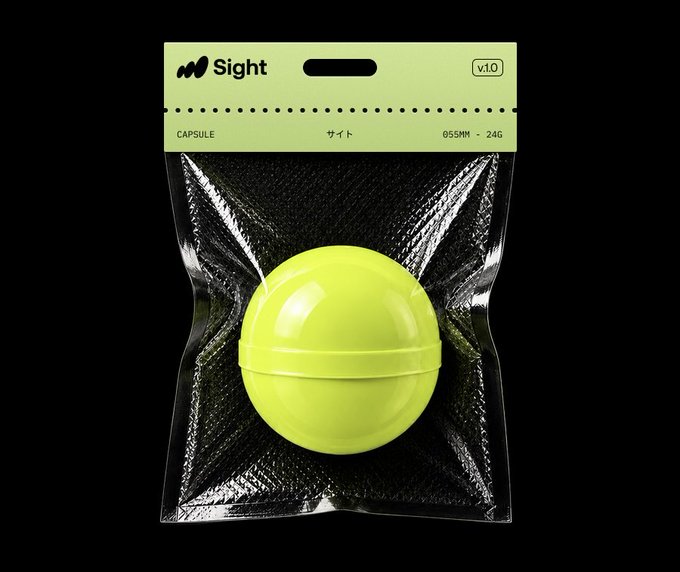 Product mockup of a yellow spherical capsule toy called 'Sight' in a clear plastic package with a lime-green header card labeled 'CAPSULE', Japanese katakana 'サイト', and '655MM - 24G', version v1.0.