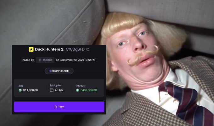 A scene from a movie showing a man with blonde hair and a curled mustache looking surprised, with a betting interface overlaid showing a $11,000.00 bet on 'Duck Hunters 2' with a potential payout of $499,396.00.