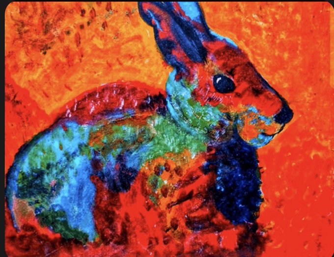 A vibrant, impressionistic painting of a multicolored rabbit with blue, green, and red tones against a bright orange background.