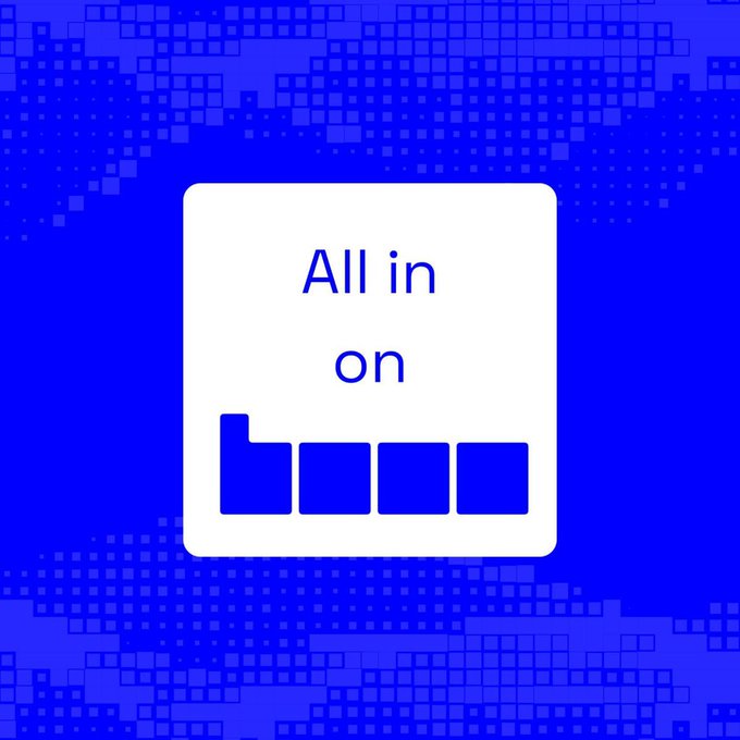 The image features a square sign with white text that reads "All in on Base Not chasing every trend. Just backing the ecosystem that keeps shipping, growing." The background of the image is blue with black dots, giving it an artistic and visually appealing look. The caption above the image provides context to the content displayed below it.