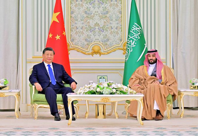 Chinese President Xi Jinping and Saudi Crown Prince Mohammed bin Salman sit for a meeting, highlighting the diplomatic ties between the two nations at a time when Saudi Arabia has withdrawn from China's mBridge digital currency platform.