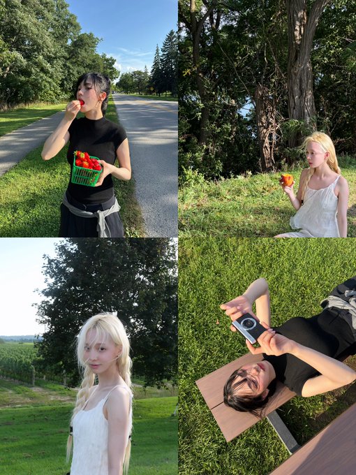 A collage of four photos featuring two young women in outdoor grassy settings; one with dark hair eating strawberries from a green basket, another with blonde hair eating an apple, both posing, and one using a digital camera while lying down.