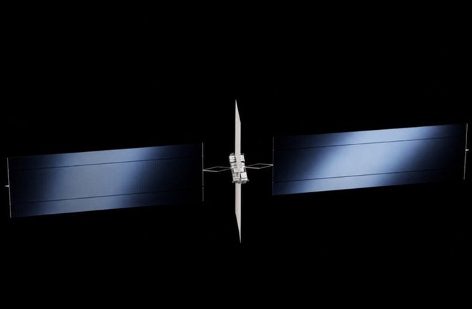 A satellite or spacecraft in deep space against a black background, featuring a central body with two large, rectangular solar panel arrays extended symmetrically on either side.
