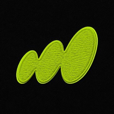 A stylized green letter 'M' embroidered logo on a black fabric background.