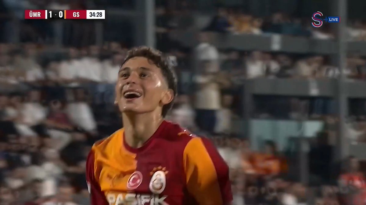 A football player in a Galatasaray jersey celebrates during a match labeled ÜMR 1-0 GS at 34:28. This image likely depicts an event related to "Ada Fin" given the context of the accompanying post.