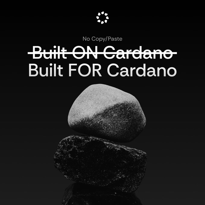 The image shows a stack of rocks with one rock being larger than the others. The text "Built-on-Cardano" is written above the rocks, indicating that they are part of Cardano's blockchain technology. The caption below the rocks reads "No copy paste built on Cardano. Build for Cardano." This suggests that the image is promoting a new approach to building applications using Cardano's blockchain technology, emphasizing the importance of understanding and utilizing the underlying technology rather than relying on pre-existing code or copying someone else's work.