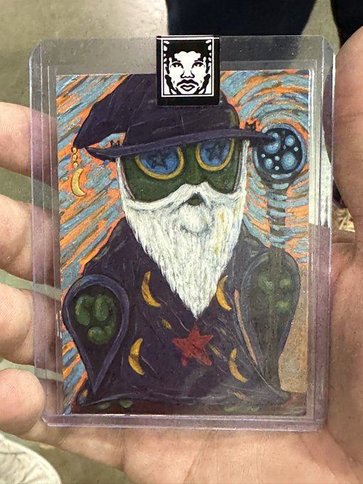 This custom VeeFriends commission by @dirtdog365 features a wizard with a moon and stars motif, topped with a black clip featuring a portrait of @garyvee.
