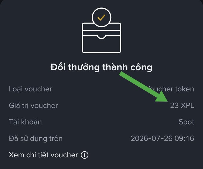 A BitMart voucher redemption success screen in Vietnamese ('Đổi thưởng thành công') showing a 23 XPL token voucher successfully applied to a Spot account on 2026-07-26, with a green arrow pointing to the value.