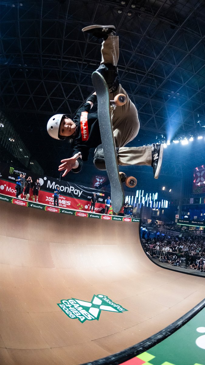 A skateboarder in a white helmet executes an inverted aerial trick above a ramp at the "X Games Chiba 2025" event, with "MoonPay" branding and a "MoonPay X Games League" logo visible on the ramp. The image captures the high-flying action from the Chiba competition referenced in the post, which encourages viewers to watch replays on ESPN ahead of the MoonPay X Games League Championship.