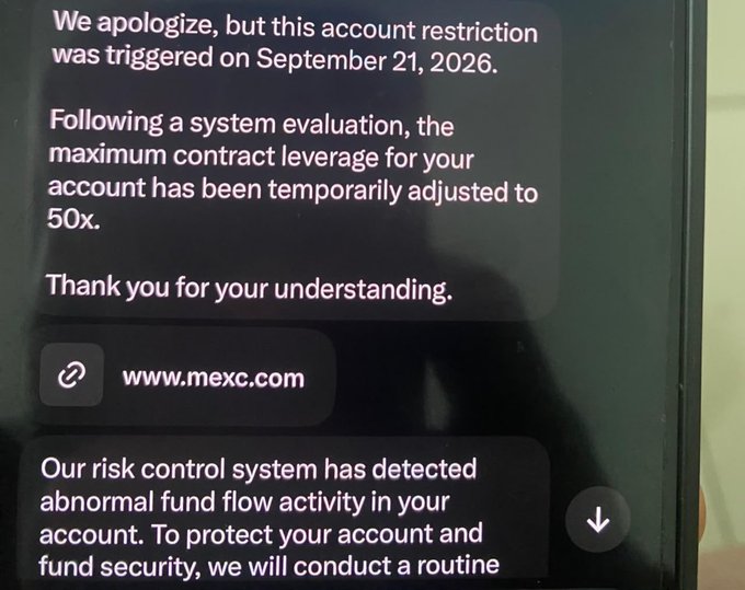 A screenshot of a notification from MEXC cryptocurrency exchange stating that an account restriction was triggered on September 21, 2026, temporarily adjusting the maximum contract leverage to 50x due to abnormal fund flow activity.