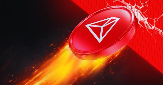 A dynamic graphic of a red TRON (TRX) cryptocurrency coin with its distinctive logo, depicted flying through flames against a dark and red background.
